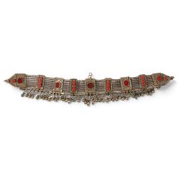 Collection of Middle Eastern jewellery, including silvered multi strand necklace with beadwork and filigree decoration with three cylindrical pendants, pendant necklace with central orange cabochon, beadwork choker and similar  