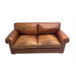 Large two seat sofa upholstered in tan 'Derwent' leather (W200cm D100cm H85cm), and matching armchair (W95cm)