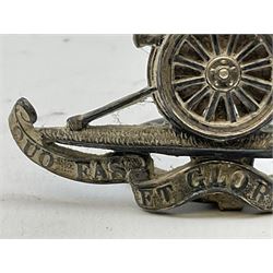 Trench Art - three WW2 brass shell case ashtrays, one mounted with Royal Artillery cap badge and button and one mounted with RA button; together with a pair of place name holders each formed from a Royal Artillery cap badge (5)