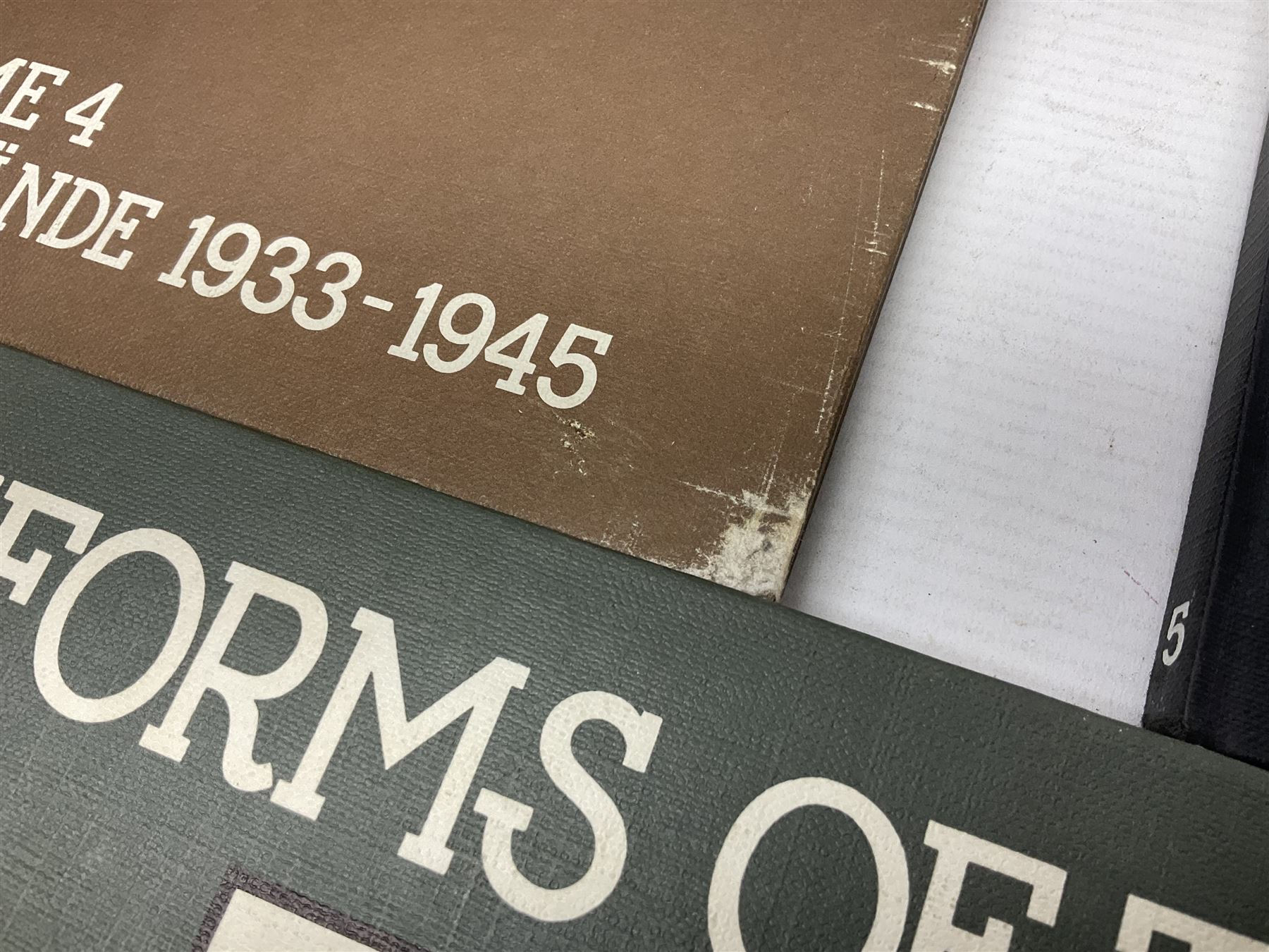 Military Collectors Service: set of three books on WWII German uniforms and badges; and Mollo Andrew: Uniforms of the SS. Volumes 1,4,5,6 & 7 (8)