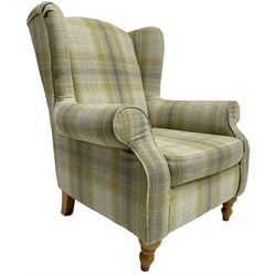 Next Home - 'Sherlock' hardwood framed wingback armchair, upholstered in pale green checkered fabric, on turned front feet