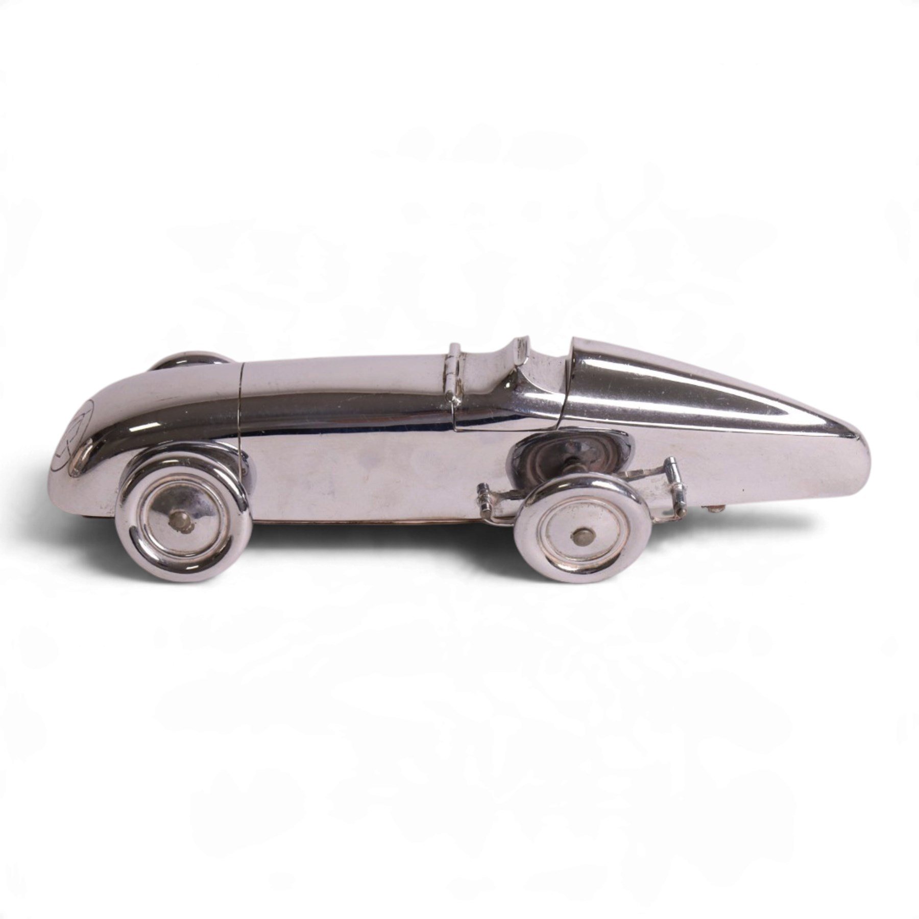 MG Magic Midget table lighter, circa 1933, chrome plated, engraved to the nose and on one side, marked beneath 'S&M, Made in England, Pat. no. 373219' 