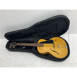 1950s acoustic guitar with f-holes and pickguard L105cm; black fur lined hard carrying case