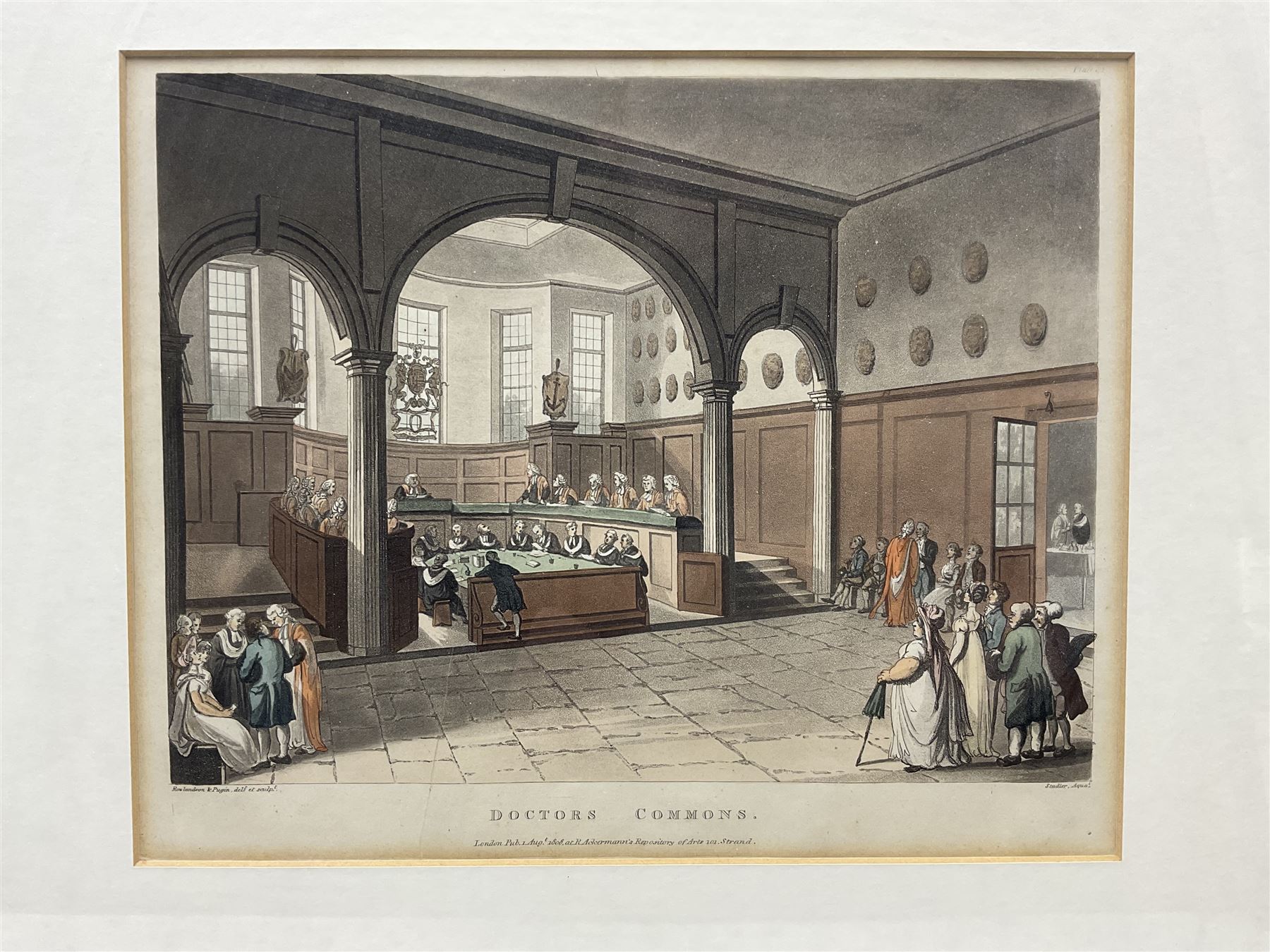 Charles Augustus Pugin (British 1762-1832) and Thomas Rowlandson (British 1757-1827): 'Guildhall' and 'Doctors Commons', pair early 19th century hand-coloured lithographs 22cm x 27cm