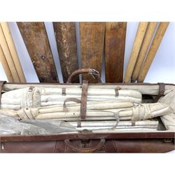 A Vintage leather cricket bag and equipment, to include cricket bats, balls, wickets, and pads. 