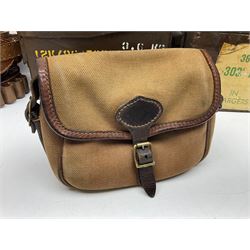 Miscellaneous shooting accessories - W.J. Bowman & Sons clay pigeon launcher; two leather cartridge belts; three cartridge bags; two canvas/leather game bags; and two metal/wooden cartridge boxes