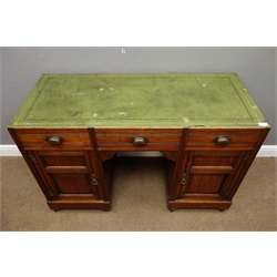  Edwardian walnut twin pedestal desk, three drawers and two panelled cupboards, W119cm, H77cm, D52cm  