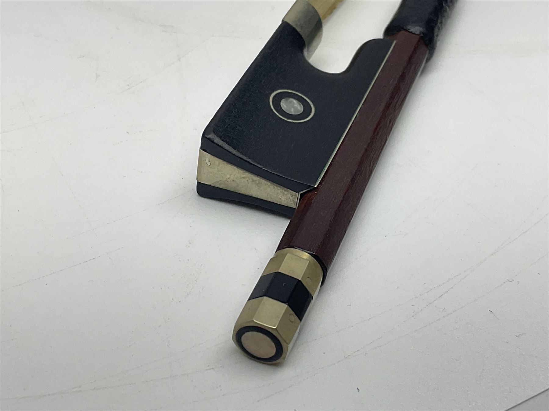 Nickel mounted pernambuco violin bow stamped R. Paesold Musical Instruments