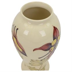 Moorcroft Columbine pattern vase, of baluster form on a cream ground, H26cm