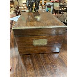  Victorian brass inlaid rosewood dressing table box, retailed by F.L. Hausburg, Liverpool, the lid centred by a brass cartouche, opening to reveal letter store to lid underside, above a fitted interior, with ten mounted cut glass jars, bottles and manicure set, within lift out leather trays, above jewellery drawer, with key, H17cm D24cm