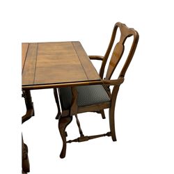 Late 20th century oak dining table, rectangular top with two draw leaf extensions, on turned supports united by moulded hayrake stretchers (180cm - 278cm x 90cm, H76cm); set of eight (6+2) oak dining chairs, shaped cresting rail over shaped splat back, upholster drop-in seat, on cabriole supports united by turned H-shaped stretchers 