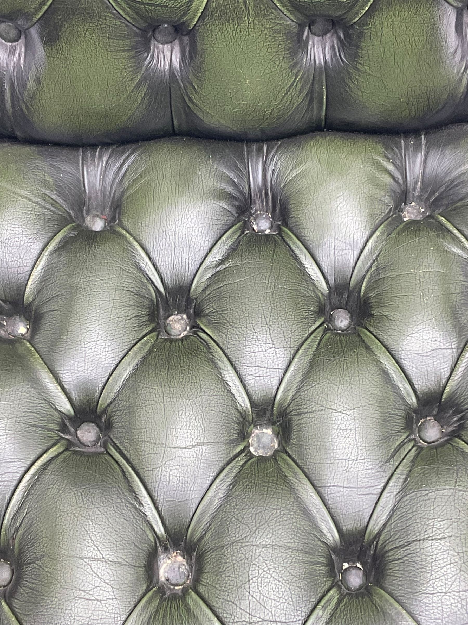 Georgian design swivel office desk chair, upholstered in buttoned green leather, on five spoke base with castors 
