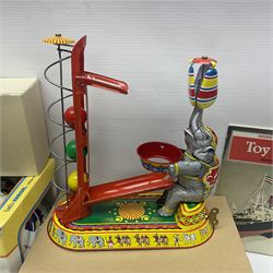 Twenty six tinplate models to include Ferris Wheel and Performing Circus Elephant, marked JW, further similar examples such as Duck on a Bike, Clown on Roller, Carousel; Popeye Tin Speedboat; Looney Tunes Wind Up Cars and Express Train; various international examples, MS107 Jumping Bambi, Pop Pop Boat, jumping frogs, pecking chickens etc; both boxed and loose