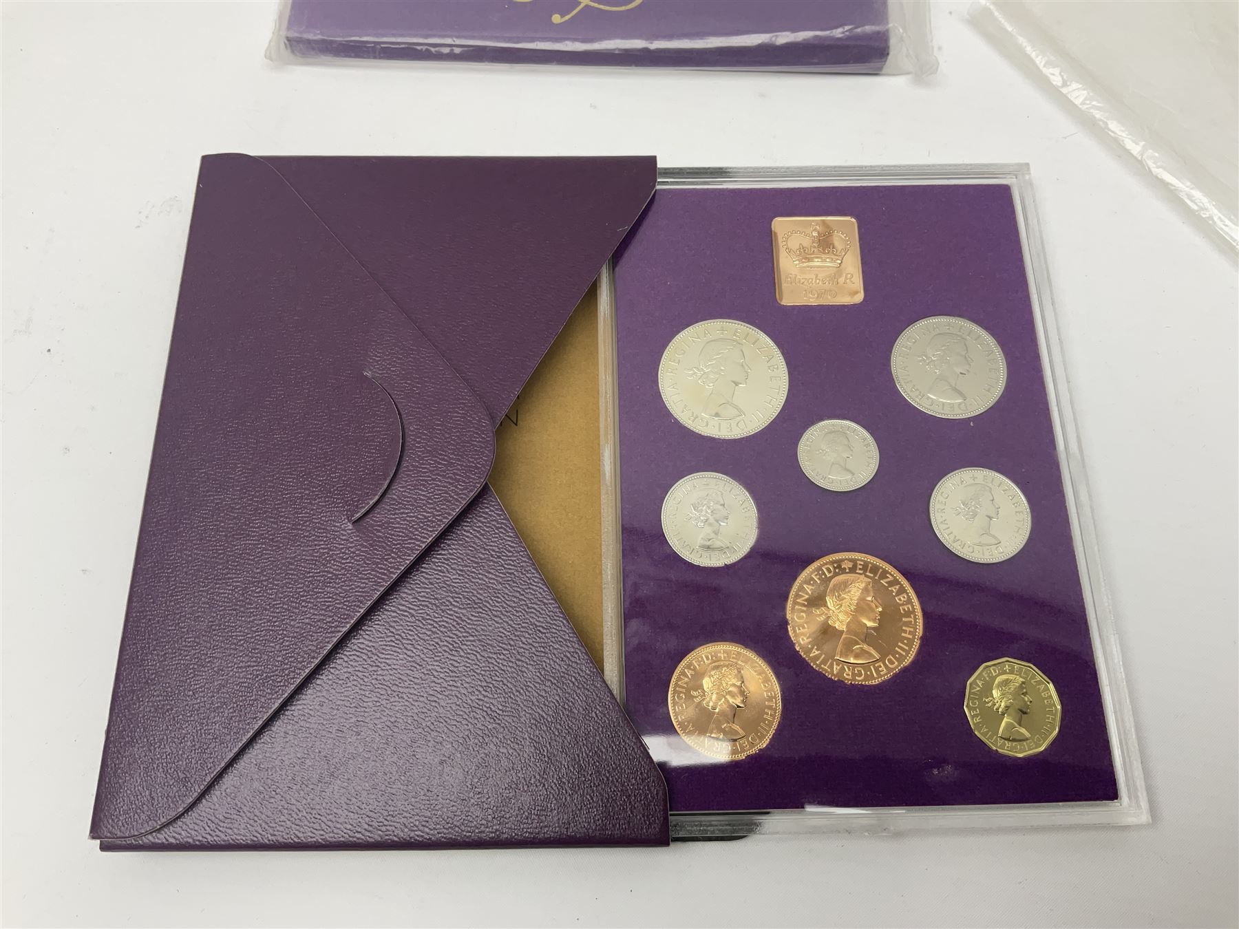 The Royal Mint United Kingdom 1983 proof coin collection in blue folder with certificate, 1983 uncirculated coin collection, two 1987 brilliant uncirculated coin collections, commemorative crowns etc