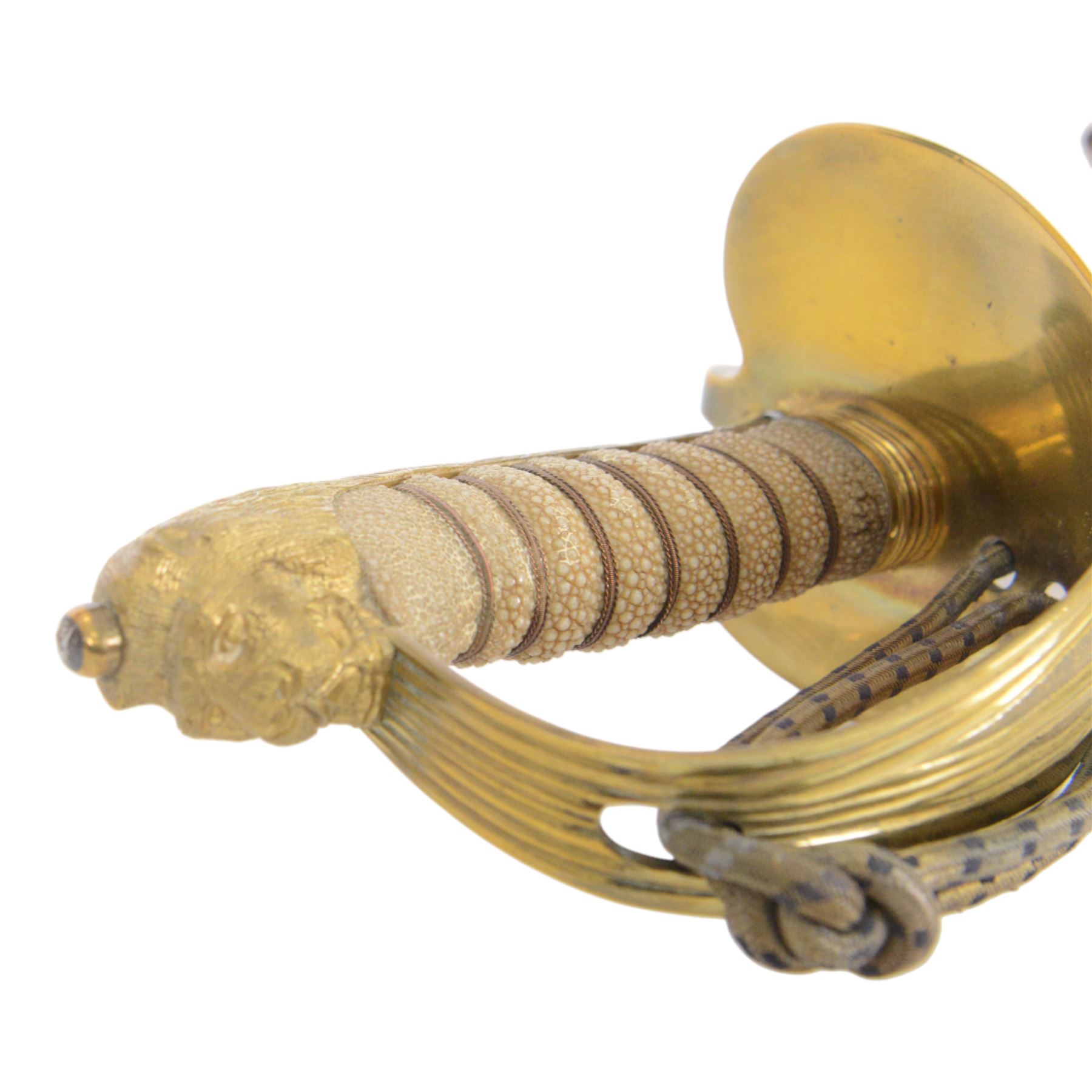 British 1827 pattern Naval officer's sword, named, by Wilkinson Sword Company in 1920 for P.H. Earle and retailed by Gives, the 80cm slightly curved blade etched to both sides, the brass guard held into scabbard by patent spring clip, lion head pommel and backstrap, with sword knot, within leather scabbard with three brass mounts, twin suspension rings and attached belt and suspension straps with gilt buckle and braid, overall L98cm 