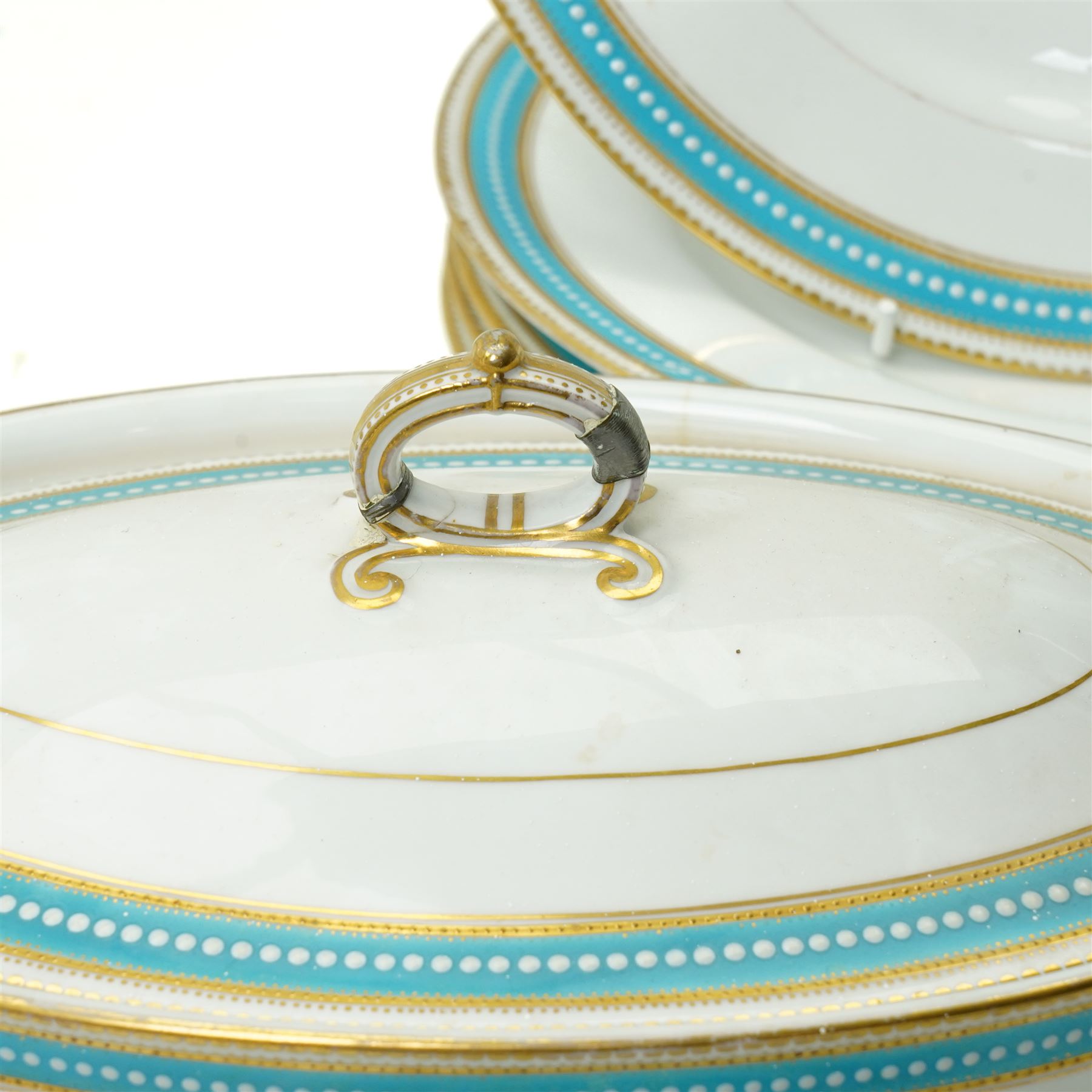 Spode Copeland's china part dinner service, circa 1900, with a blue and gilt jewelled border comprising ten dinner plates, seven dessert plates, two side plates, pair of vegetable dishes and covers, two sauce tureen stands and oval meat plate retailed by T Goode, London