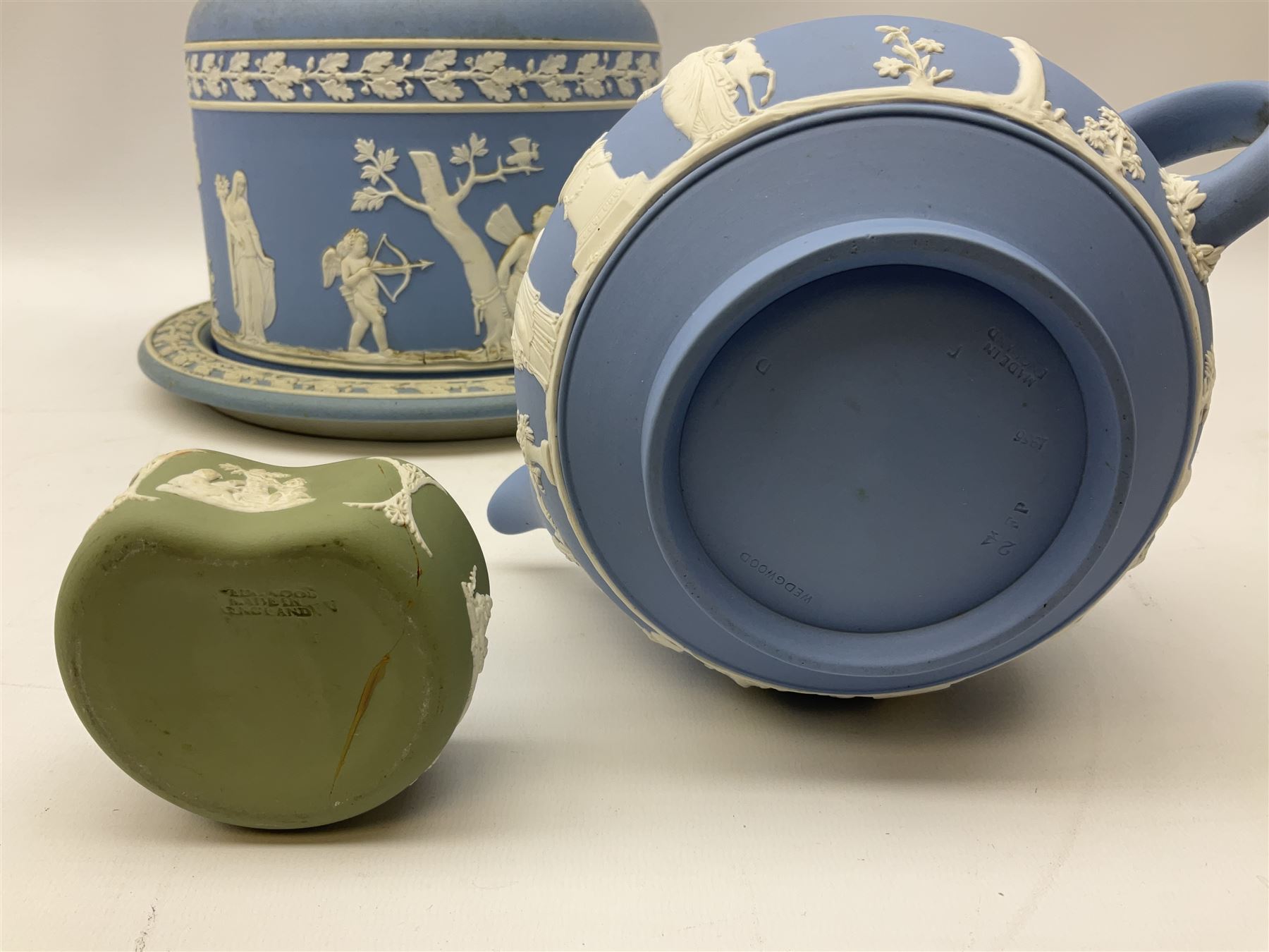 Late 19th century pale blue Wedgwood Jasperware cheese dome with cover, decorated with acorn and oak leaf bands surrounding neo-classical ladies, cherubs, flowers and trees, impressed Wedgwood mark beneath, together with further Wedgwood Jasperware teapots, boxed dishes etc