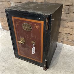 Samuel Withers & Co of West Bromwich - Victorian cast iron safe, the brass handle modelled as a clenched fist, painted in red, orange and black, with key. Ground floor delivery only, no steps.