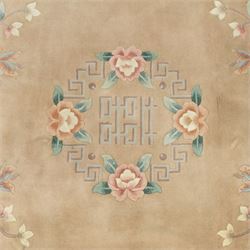 Chinese wool rug, beige ground decorated with peonies, flowering branches and butterflies, centred by a shou symbol within key pattern surround, cream border with floral sprays and double happiness motifs, cotton fringe ends