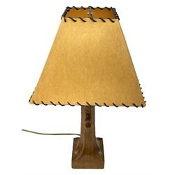 'Mouseman' tooled oak table lamp, the octagonal tapered stem carved with mouse signature, with shade, by Robert Thompson of Kilburn