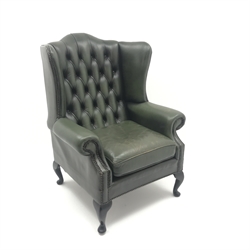  Queen Anne style wingback armchair upholstered in deep buttoned green leather, cabriole legs, W82cm  