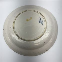 18th century Delft blue and white peacock pattern dish, painted with a fan of peacock feathers behind an urn of fruit and flowers, D34.5cm. 