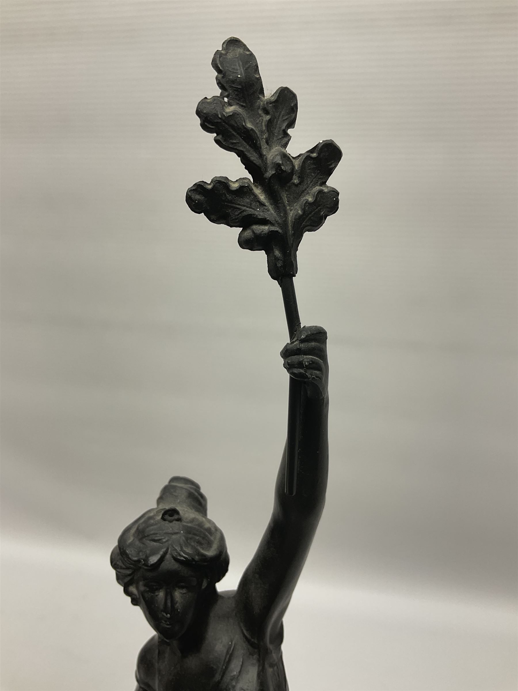 Pair of spelter figures, Le Force and Le Pouvoir, modeled as figures standing on lions, arms held aloft, H51cm 