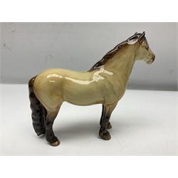 Two Beswick figures of horses, comprising Dun highland pony, model no 1644, together with Appaloosa stallion, model no 1772, both with printed mark beneath, largest H20cm