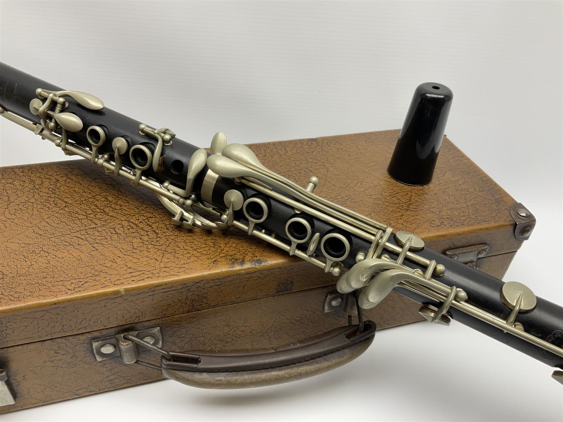 Buffet Crampon Paris African blackwood four-piece clarinet with nickel fittings, impressed 'BCPB 1937', multiple stamps for 'Macdonough & Son Sole Agent London' L67cm; in rexine covered case with two unused reeds. Biographical information: The Macdonagh family have links with the Royal Philharmonic Orchestra and are also reputedly linked with Thomas Macdonagh who was involved in the 1916 Irish uprising.