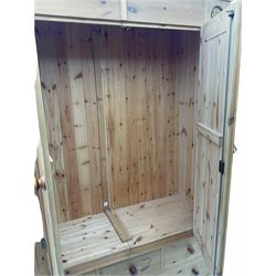 Pine double wardrobe, fitted with five drawers