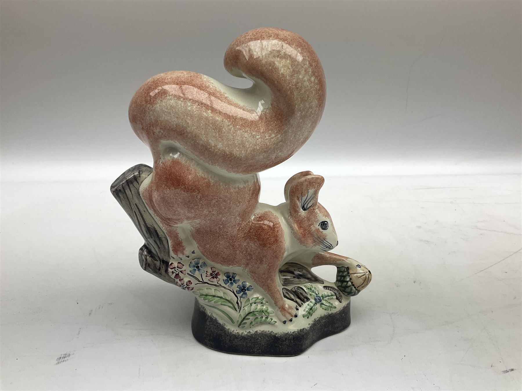 Six Rye Pottery figures, comprising, jumping fox, squirrel upon a branch, billy goat, bull, chicken and cockerel  