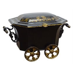  Regency Toleware coal wagon, elongated octagonal body with C scroll cast handles, stepped domed lid with chinoiserie scroll border and on four five spoke cast gilt wheels, W55cm, D37cm, H38cm, with tin liner  