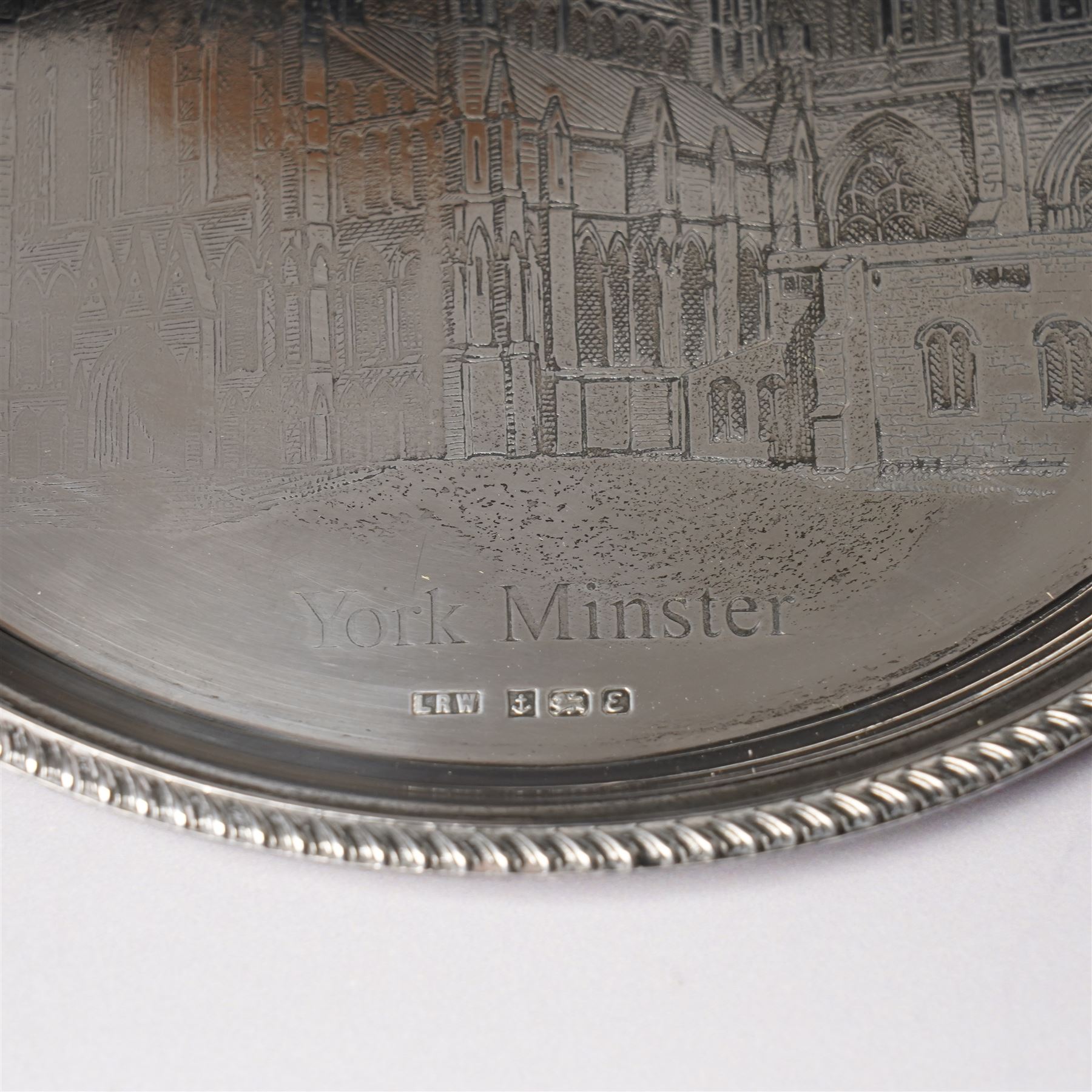 Silver circular York Minster salver with gadrooned border engraved with a view of the Minster in case D21cm Birmingham 1979 Maker Laurence Watson & Co