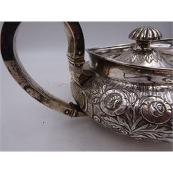 George III Irish silver teapot, of squat circular form, the body with repousse and chased floral and C scroll decoration, with capped C handle and ivory insulators, engraved to base 'Presented to Troop Sergeant Major John Percival, of the 4th Dragoon Guards by Alex D. Tait, Esq, late Captain in that corps as a mark of approbation of his steady and upright conduct when Sergeant Major of his Troop, Dublin, June 2nd 1843', hallmarked William Law, Dublin 1817, H12.5cm, This item has been registered for sale under Section 10 of the APHA Ivory Act