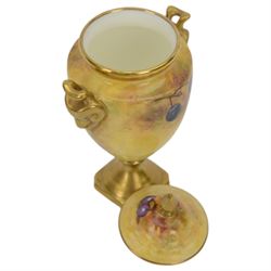 Coalport pedestal vase and cover, of urn form hand painted with fruit with gilt detail, signed J Mottram, H18cm