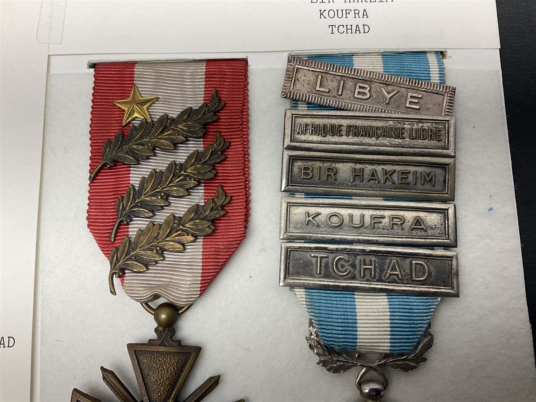 French Republic Colonial Medal with five clasps for Libye, Afrique Francaise Libre, Bir Hakeim, Koufra and Tchad; and Croix de Guerre Des Theatres D'Operations Exterieurs with three MID leaves and gold star; both with ribbons (2)