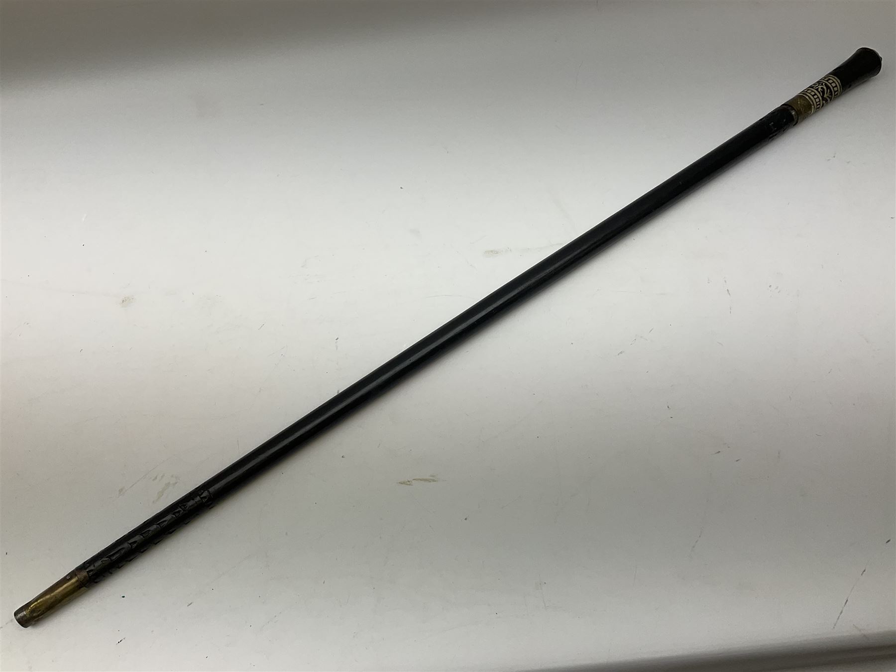 
Late 19th/early 20th century Anglo Indian ebony and bone sword stick with 62cm steel blade, brass locking ferrule and lion mask pommel L92 cm.