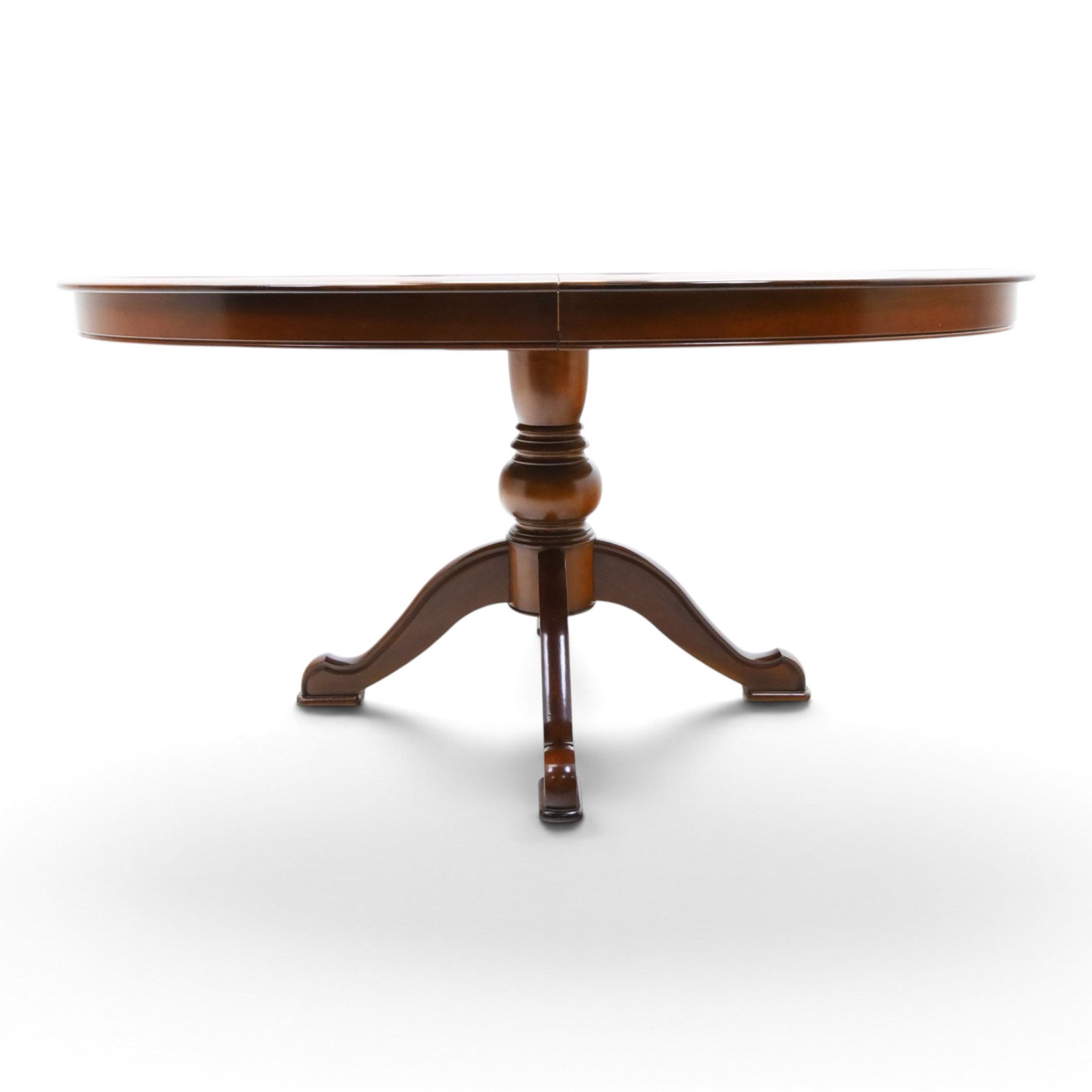 Barker & Stonehouse - cherrywood oval extending dining table and four upholstered chairs, the table with additional leaf extended to cm, raised on a turned column above swept supports, the chairs with brown upholstery and multi-coloured geometric design