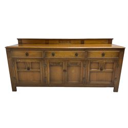 Mid-20th century oak dresser, fitted with three drawers and four cupboards