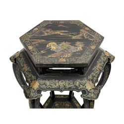 Chinese black lacquer jardinière stand, the hexagonal top painted with traditional landscape scenes within a gilt strung border, the pierced frieze with trailing foliate decoration and geometric patterns, supported on six cabriole supports united by a raised hexagonal base