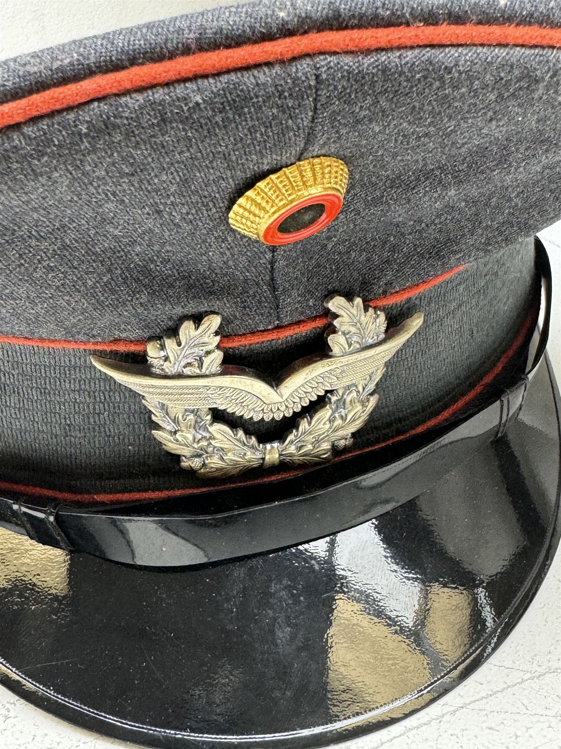 West German helmet steel helmet, together with 1960's peak cap and tunic with German insignias 