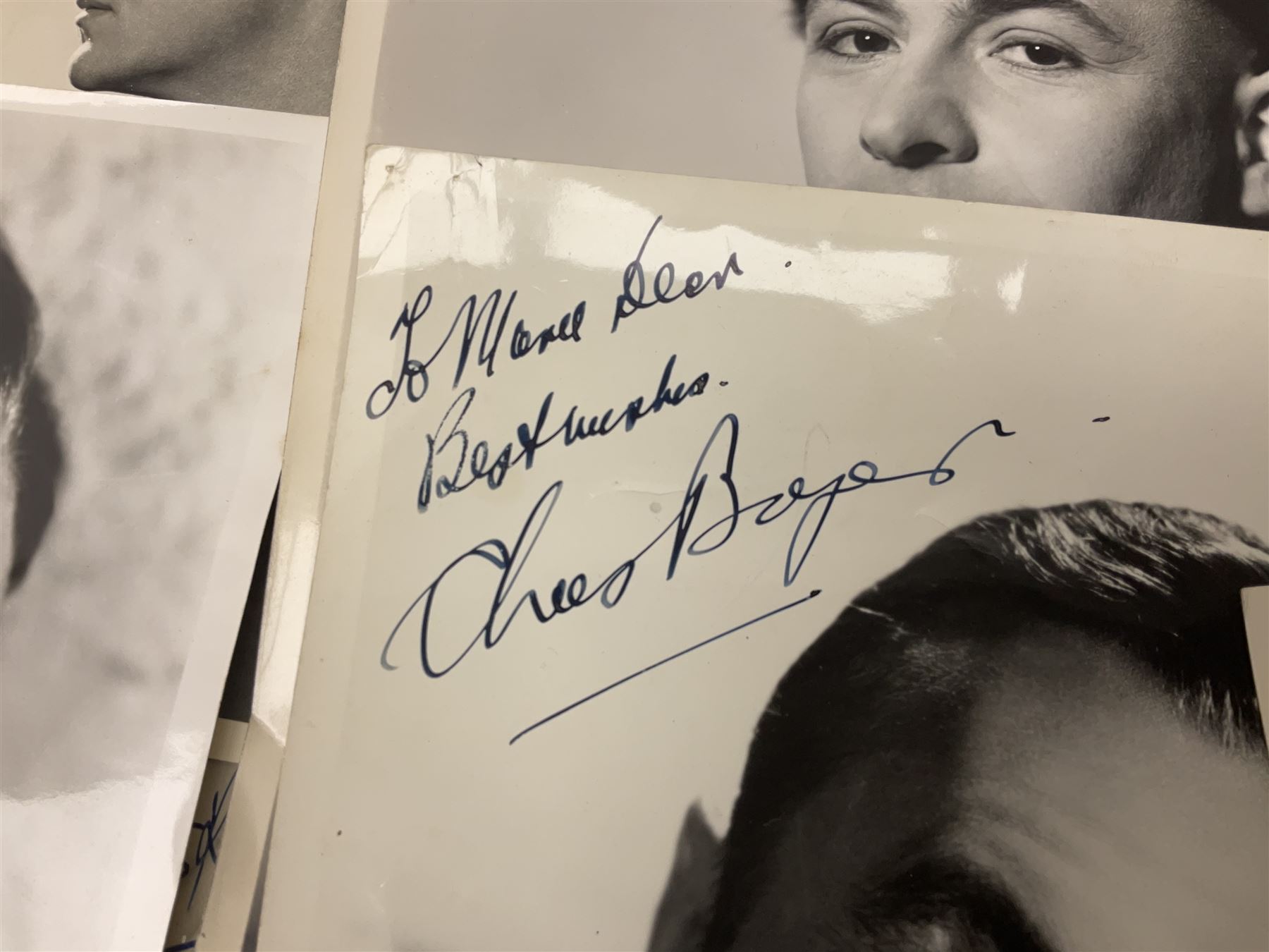 Early 20th century ephemera, to include signed photographs of Charles Boyer and Walter Pidgeon etc, a printed letter from Winston Churchill, two albums and a quantity of transfer books of Players and similar cigarette cards, including Boy Scout and Girl Guide Patrol Signs and Emblems and RAF Badges, a collection of greetings cards and postcards, a photograph album containing black and white photographs of Caius College Cambridge and guides and pamphlets on travelling Switzerland and the UK