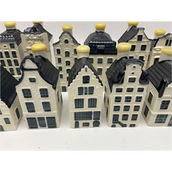 Twenty seven KLM Bols Blue Delft's decanters in the form of Dutch houses, some with contents