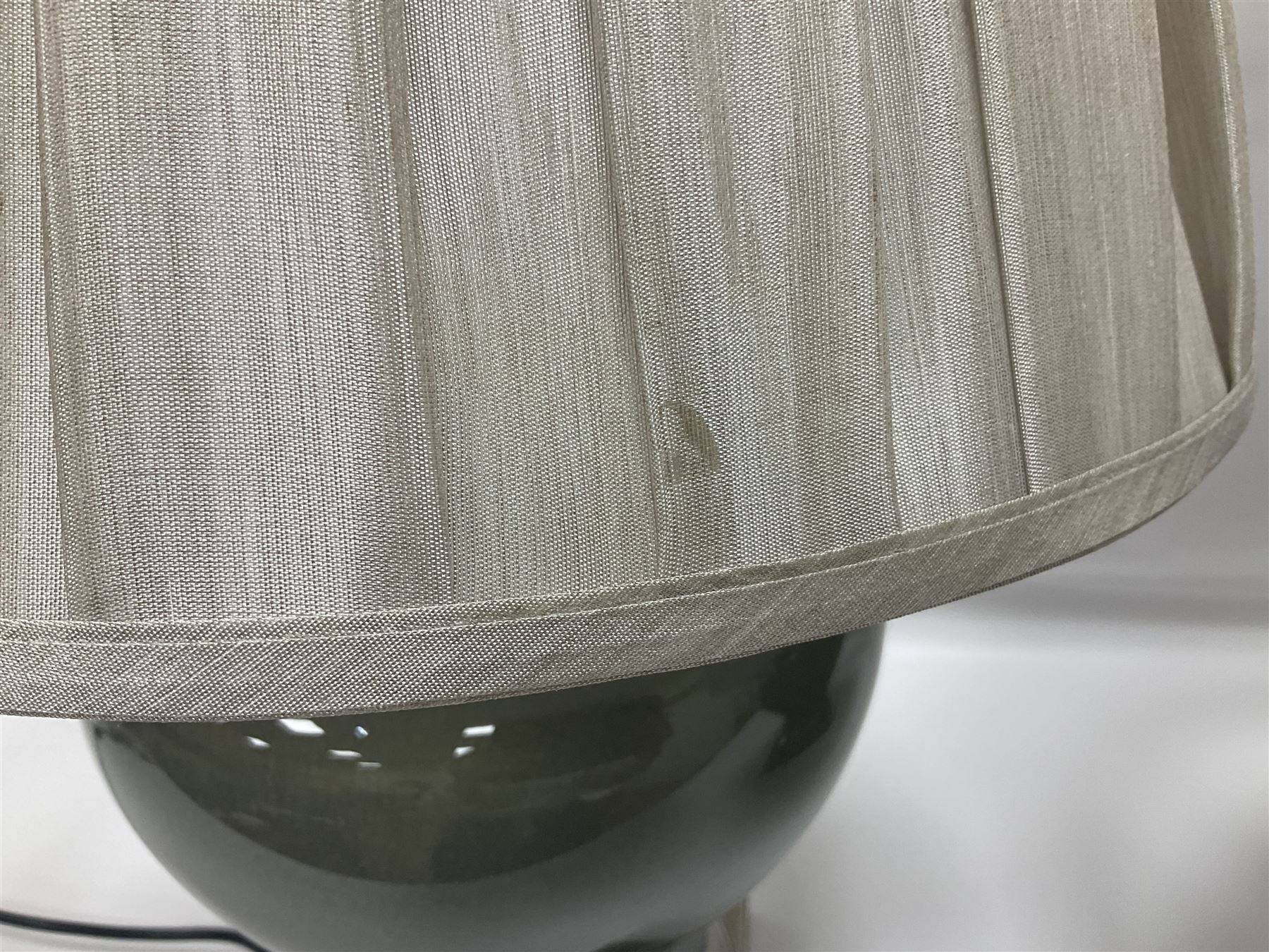 Pair of table lamps of squat baluster form, with a crackle glaze to a dark grey ground, upon a square base, including shade H57cm