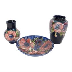 Moorcroft pansy pattern vase, of baluster form, together with Anemone pattern vase and dis...