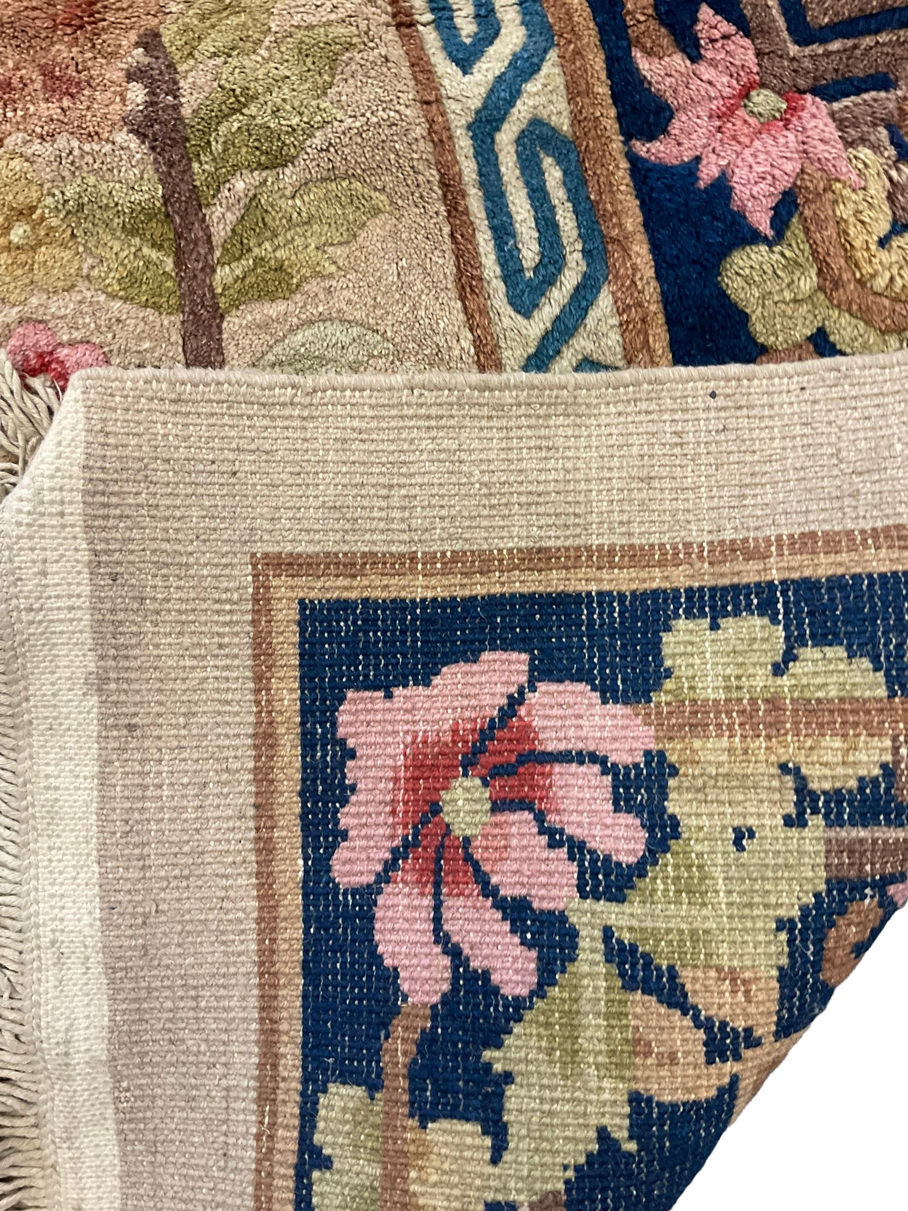 Chinese beige ground rug, blue border