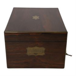  Victorian brass inlaid rosewood dressing table box, retailed by F.L. Hausburg, Liverpool, the lid centred by a brass cartouche, opening to reveal letter store to lid underside, above a fitted interior, with ten mounted cut glass jars, bottles and manicure set, within lift out leather trays, above jewellery drawer, with key, H17cm D24cm