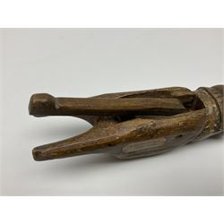 Rare primitive treen lever action nutcracker, probably late 17th/early 18th century, carved in the form of a man, with old collector label to side inscribed 'A Nutcracker XVI Century', H18cm
