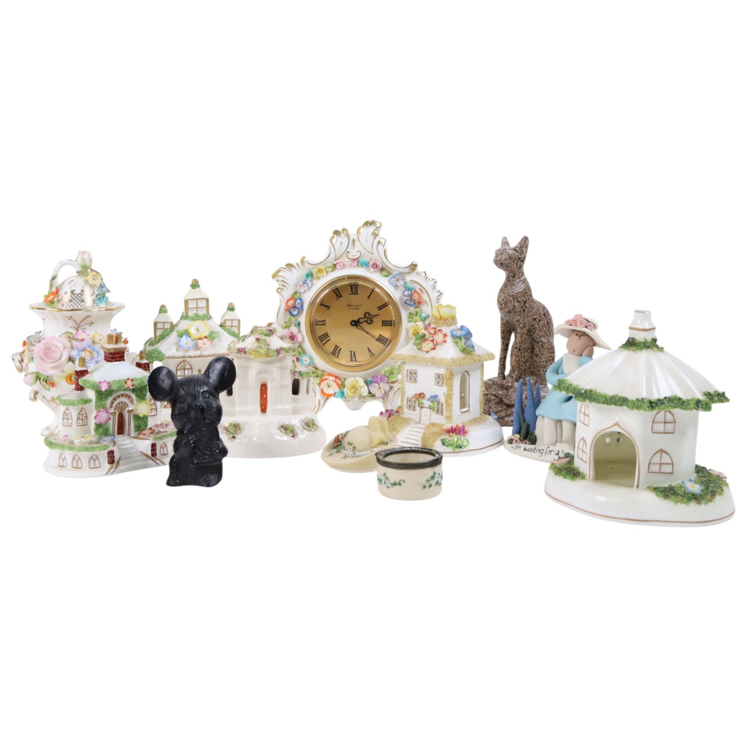 Collection of Coalport items, comprising floral mantel clock, houses including 'Park Lodge' 'The Umbrella House' 'Keepers Cottage', Coalbrookdale floral jar, and others; Kingmaker mouse ornament; Egyptian-style granite Bastet cat ornament, in one box