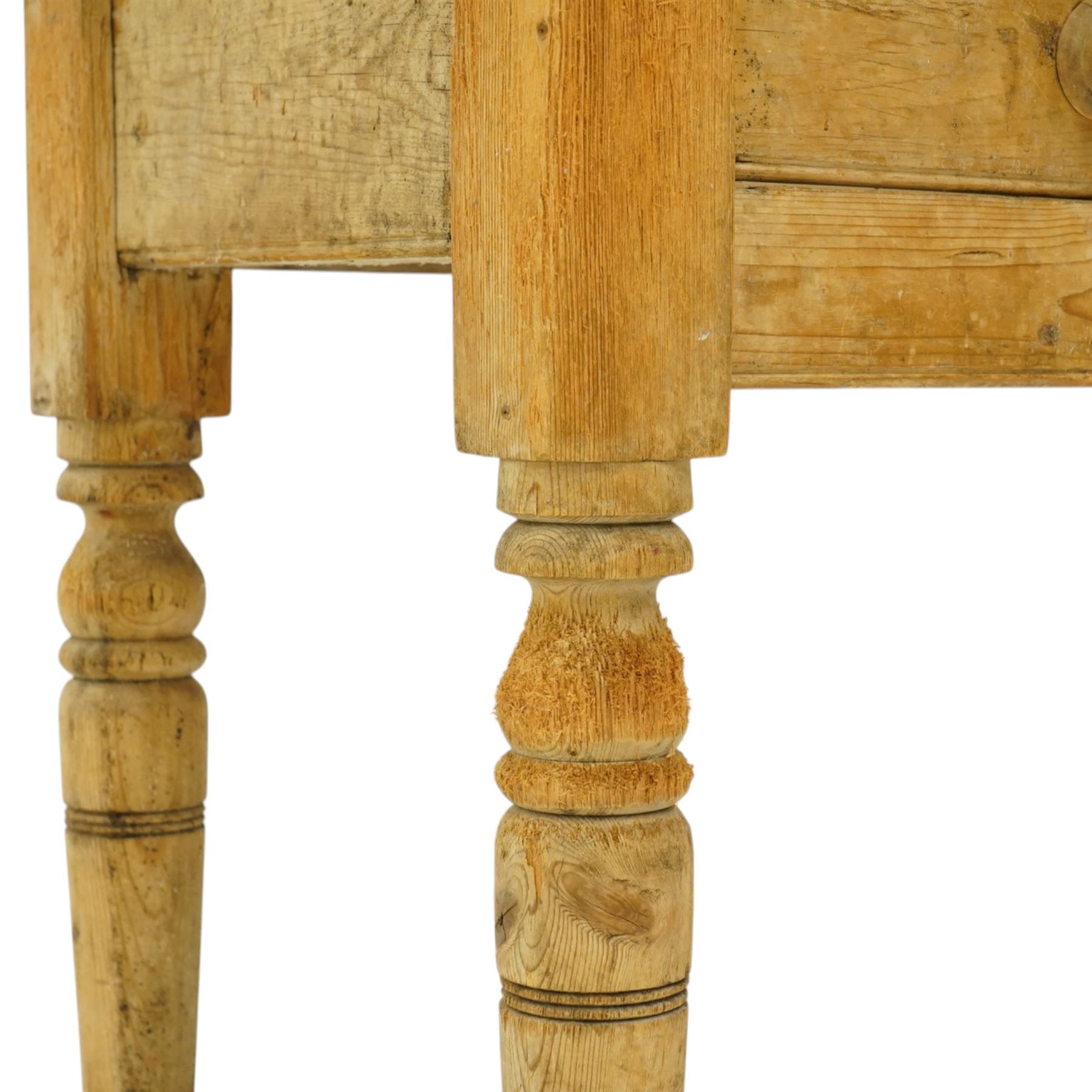 Victorian stripped pine table fitted with two drawers, supported on turned supports